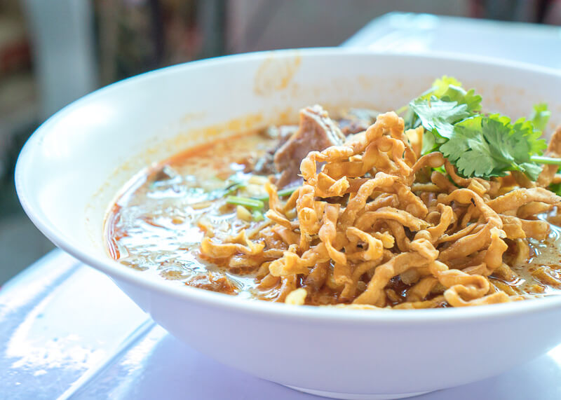 the best khao soi in our travels in thailand as modern nomads