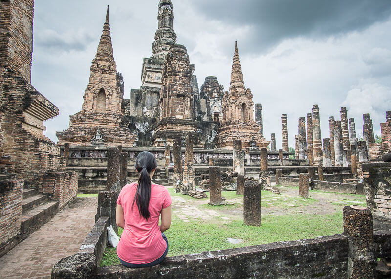 sitting down to admire temples in sukhothai thailand