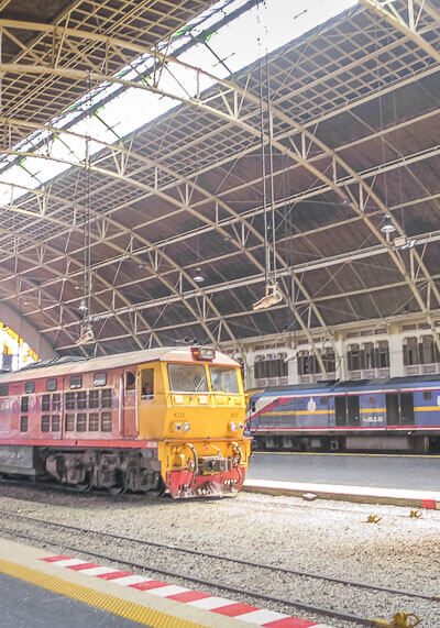 This Is What The Bangkok Train Station Looks Like (aka Hua Lamphong Station) | There are tons of things to do in Krabi and Bangkok. If you’re trying to plan how to get from one place to the next during your vacation or honeymoon, you will want to read this post on your travel options in Thailand and what Thailand train travel looks like! Beach travel #travel #nomad #lifestyle #destinations #thailand #krabi #phuket #slowtravel #wanderlust